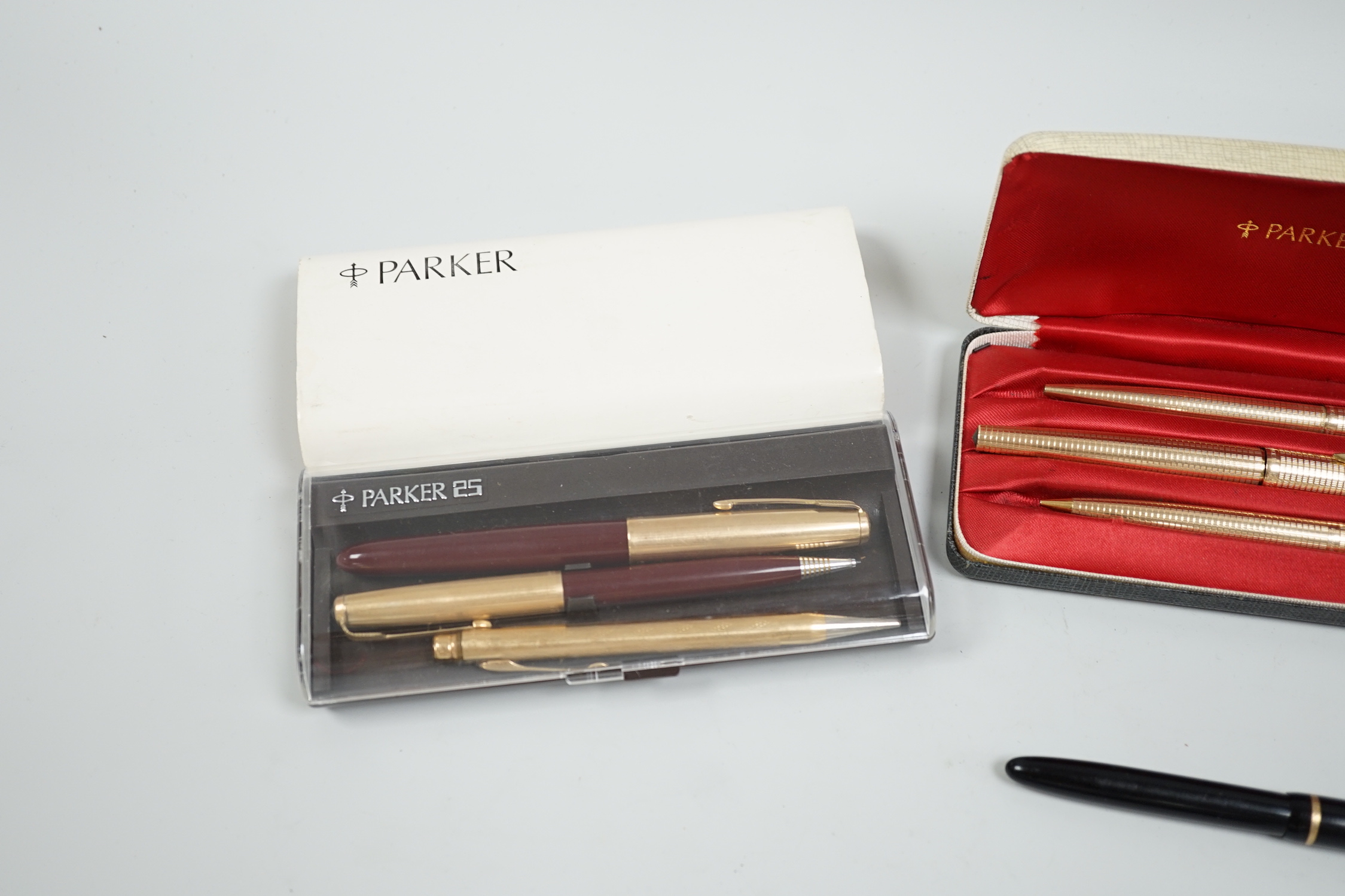 A Parker gold plated pen/pencil biro set and other Parker pens